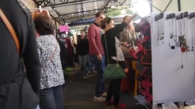 Walking Forward In Market Surrounded By People Walking By - Walking Forward