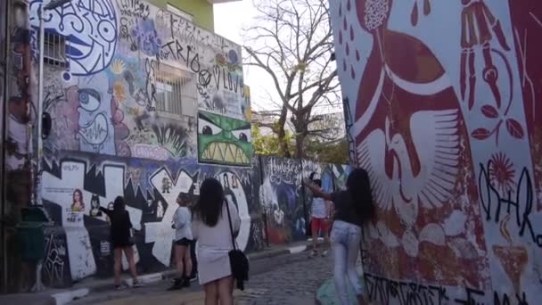 People Watching Colorful Graffiti Wall Walking Slide Right Left — Wideo stockowe