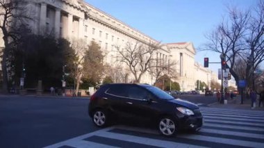 Cars Crossing At Intersection Near Monument - Static