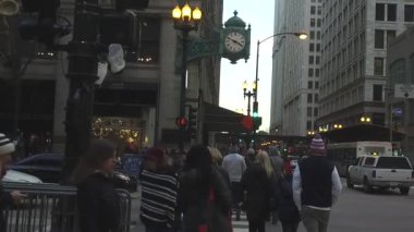  People Walking In Street Near Clock - Static - Slow Motion.