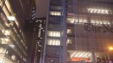 The New York Times Building Near Street Lanterns From Below - Pan - Left To Right.