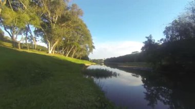  A beautiful lake in a green park - Pan - Left to right