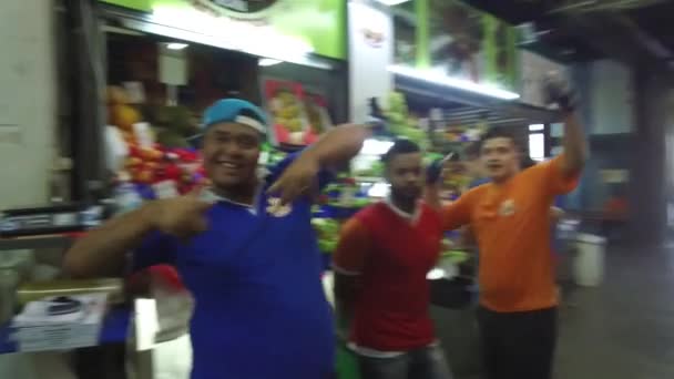 Men Having Fun Posing Front Indoors Market Stand Pan Right — Stock Video