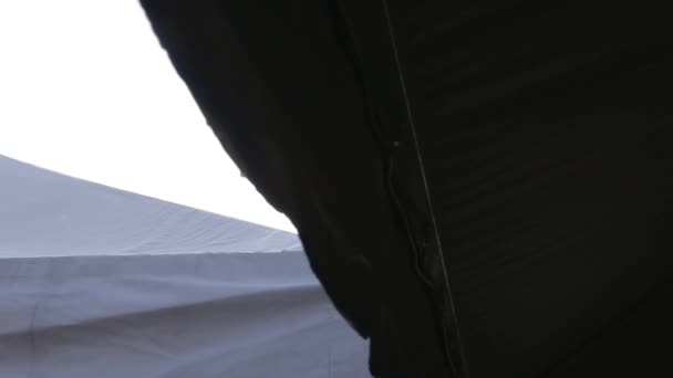 Sun Shining Tent Roofs Slide Right Left — Stock Video