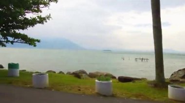Side view of a huge lake with mountains in the back
