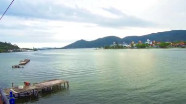 A Brazilian man preparing to fish in a lake