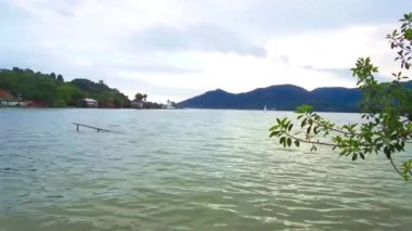View of lake from the backyard of a restaurant - pan