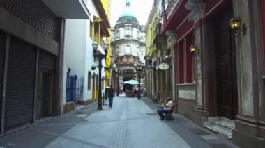  Walking towards the historic Coffee Museum in the downtown of the city of Santos.