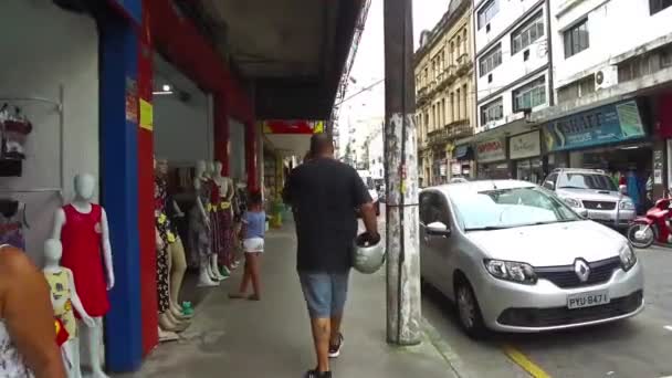Guy Phone Helmet Walking Sidewalk Downtown Santos — Stock Video