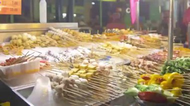 Different amazing food options at a steam boat stall at a night market