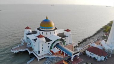 Top Aerial View of the Beautiful White Mosque Beside the Sea with City Views