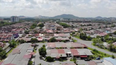 Top Aerial View Of Residential Housing With Roads In Melaka Malaysia With A Mountain View - Dolly Left To Right.