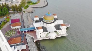 Top Aerial View of the Beautiful White Mosque Beside the Sea with City Views