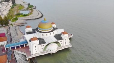 Top Aerial View From the Sky of a Beautiful White Mosque with Sea View