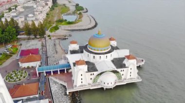 Top Aerial View of the Beautiful White Mosque Beside the Sea with City Views