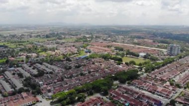 Top Aerial View of Housing with Small Roads and Mountain Views in Melaka Malaysia - Moving Up.