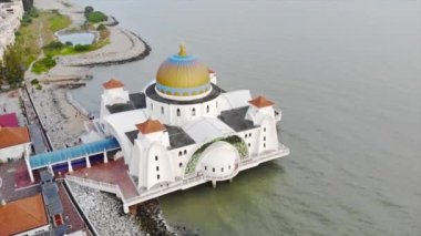 Top Aerial View of the Beautiful White Mosque Beside the Sea with City Views