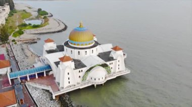Top Aerial View of the Beautiful White Mosque Beside the Sea with City Views