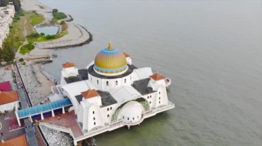 Top Aerial View of the Beautiful White Mosque Beside the Sea with City Views