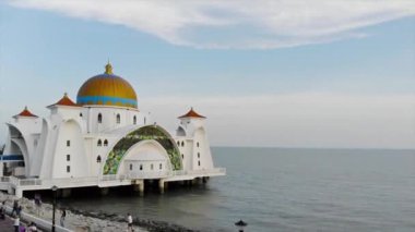 Top Aerial View of the Beautiful White Mosque Beside the Sea with City Views