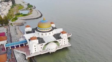 Top Aerial View of the Beautiful White Mosque Beside the Sea with City Views