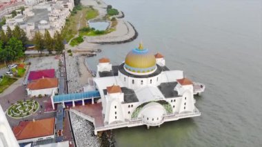 Top Aerial View of the Beautiful White Mosque Beside the Sea with City Views