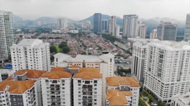 Top Aerial View of City and Mountain Views - Backwards.