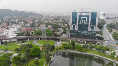  Top Aerial View of lake with a garden full of trees in the city of Malaysia