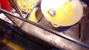 The Process of Cooking Street Food at the Night Market - Hand Held.