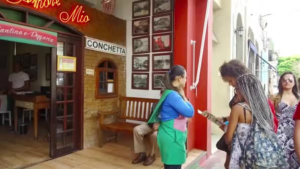 Women Standing Reading Front Shop Backwards — Stock Video