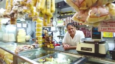 Happy Shop owner at the Municipal market in Belo Horizonte