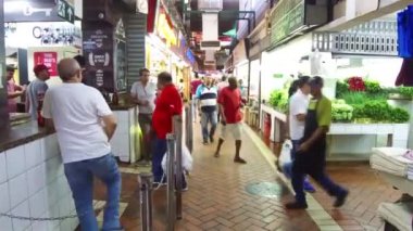 People walking around near grocery shop