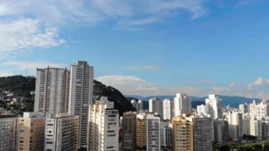 Aerial reveal of an island city with buildings