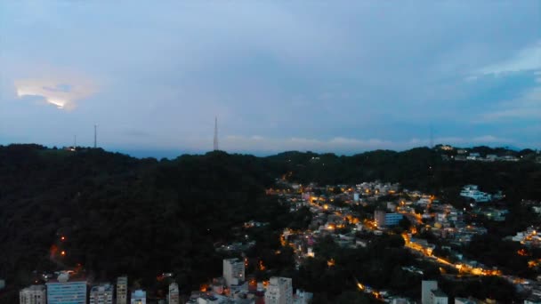 Front Aerial Night View House Lights Mountains Dolly Back — Vídeo de Stock