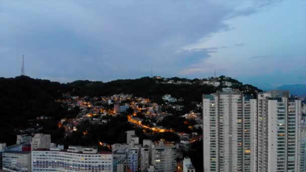 Front Aerial View City Santos Night Lights Mountains Crane Left — Αρχείο Βίντεο