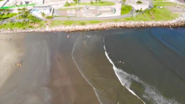 Top Aerial view of a skating park on th beach shore - Dolly Back