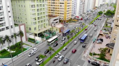 Top Aerial View of Busy Road with Traffic on an island city - Crane Down