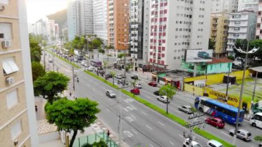op Aerial View of Busy Road with Traffic on an island city - Crane Up.