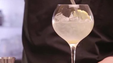  Add Lemon with Garnish Tong - Close Up.