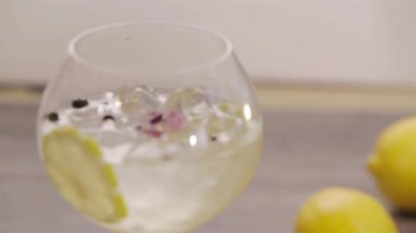 Yuzu Gin And Tonic Drink on background, close up