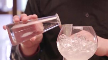 Measuring Water Mix With a Jigger Cup.