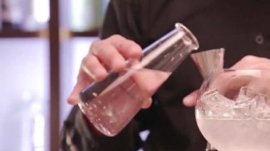 Pouring Liquid With Jigger Cup 
