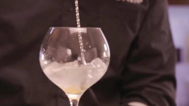 Stirring the Liquid in the Glass - Close Up