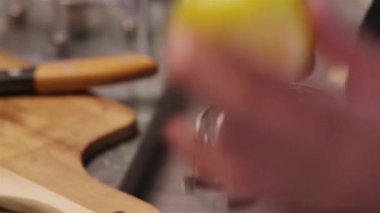 Squeeze Lemon Into a Blender on background, close up