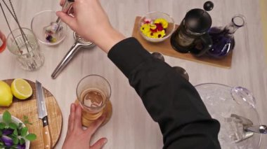 Adding Ice With Flowers Inside - Close Up