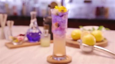 ppearance of 2-Color Drinks with Garnish Flowers - Pull Focus.