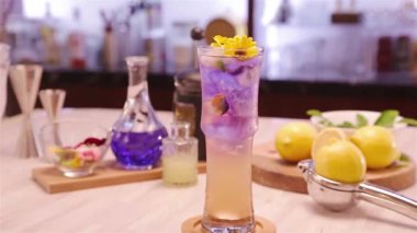 Appearance of Drinks With Garnish Flowers - Tilt Down.