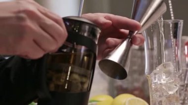 Pouring Liquid From Jigger To Glass.