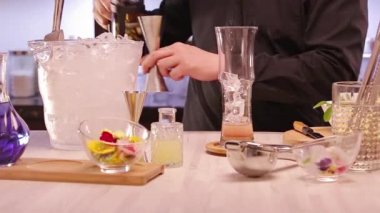 Pouring Liquid With a Jigger Into a Glass.