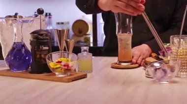 Take Ice Flower with Garnish Tong - Slide Right to Left.